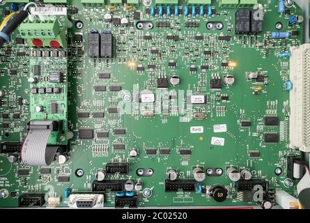 Huelva, Spain - June 11, 2020: Electronic circuit board from fire detection station with many chips and soldered joints. Stock Photo