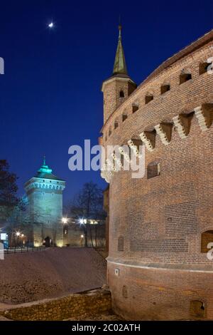The Barbican, Krakow, Poland. It is a circular bastion constructed in 1498 and originally surrounded by a moat. The tower is St. Florians Gate, one of Stock Photo