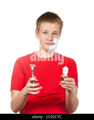 teenager the first time tries to have a shave and Stock Photo