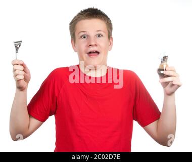 teenager the first time tries to have a shave and Stock Photo