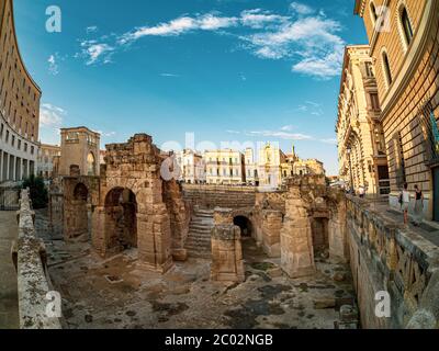 Wide view of the old historical ruins architecture of the Roman amphitheater arena in Lecce city, Italy Stock Photo