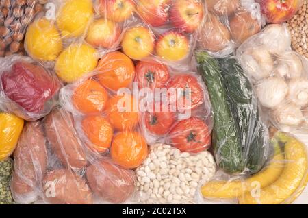 Plastic packaging. Fruits and vegetables in plastic bags Stock Photo
