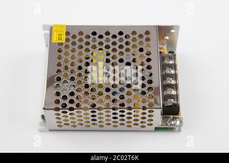 Transformer for LED lighting. Power supply, transformer for making advertising, LED screens and scoreboards on a white background. Stock Photo