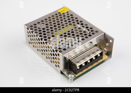 Transformer for LED lighting. Power supply, transformer for making advertising, LED screens and scoreboards on a white background. Stock Photo