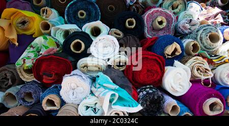 fabric of different colors in rolls Stock Photo