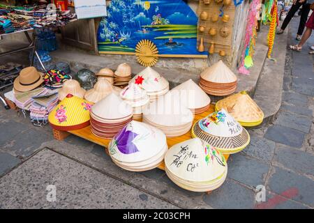 Traditional Vietnamese hats and other souvenirs, Le Loi street, old town, Hoi An, Vietnam, Asia Stock Photo