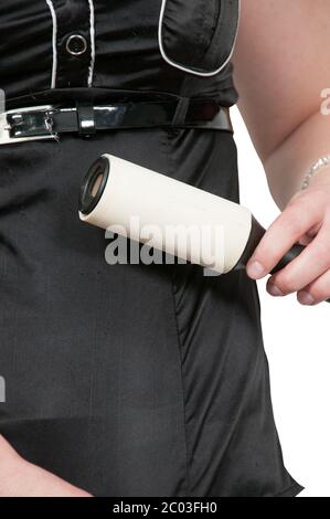 Woman using lint roller Stock Photo