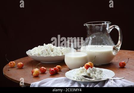 Milk in a transparent jug and cottage cheese with Stock Photo