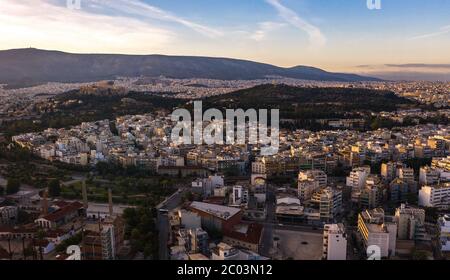 Panoramic View over Athens by Sunrise with old city downtown and Acropolis skyline Stock Photo