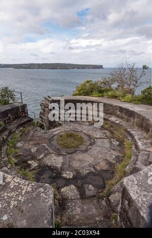 Former large artillery gun emplacements above the cliff line on Middle Head in Sydney Harbour with a direct line of sight to the harbour entrance Stock Photo