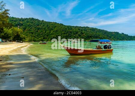 Teluk Dalam Beach, Besar, Perhentian Islands, Malaysia; May-2019; The boat and the sea Stock Photo