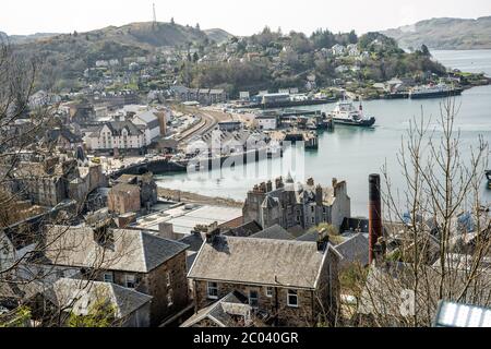 View of the McCaig's Tower on Battery Hill overlooking the town of Oban in Argyll and Bute, known as the seafood capital of Scotland. Stock Photo