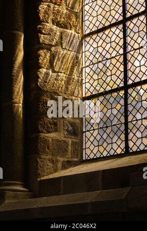 Light shining through stain glass window. Stock Photo
