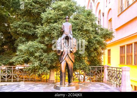 PRAGUE, CZECH REPUBLIC - JUNE 26, 2019: Franz Kafka Monument in Jewish Quarter of Prague. Unusual memorial of sculptor Jaroslav Rona, Prague, Czech Republic. Stock Photo