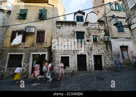 Walking through the narrow old streets of the Diocletians Palace in Split, Croatia. Stock Photo