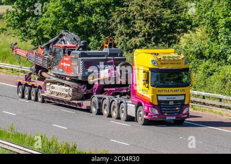 Ruttle Plant Ltd: Haulage delivery trucks, lorry, transportation, Heavier Vehicles (LHVs),  Lowloader 8 Axle truck, STGO CAT3 cargo carrier, DAF vehicle, European commercial transport industry HGV, M6 at Manchester, UK Stock Photo