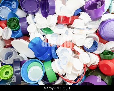 Plastic bottle caps of assorted colors and sizes ready for recycle Stock Photo