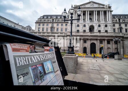 London- June 2020: Bank of England with newspaper headline 'Britain is Closed' referencing the Coronavirus Stock Photo