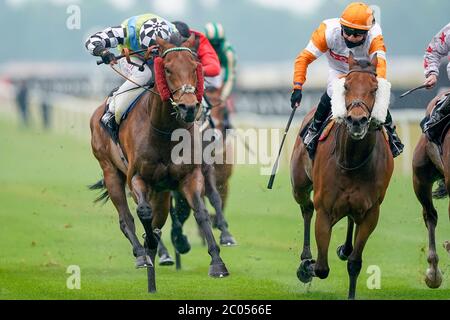 Global Hope and jockey Oisin Murphy (left) wins the It's Not Rocket Science With MansionBet Handicap at Newbury Racecourse. Stock Photo