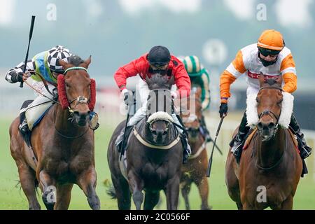 Global Hope and jockey Oisin Murphy (left) wins the It's Not Rocket Science With MansionBet Handicap at Newbury Racecourse. Stock Photo