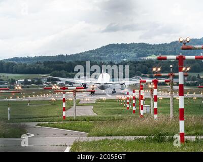 Small Aircraft landing at Zürich Airport, Switzerland Stock Photo