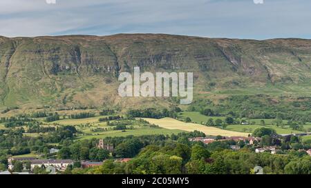 The village of Lennoxtown with the High church of Campsie in Lennoxtown, prominent in the image Stock Photo