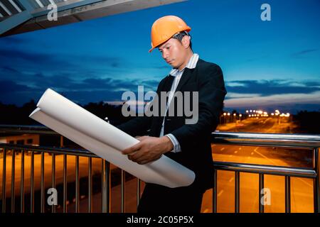 Two engineers standing on the bridge over the bridge. Stock Photo