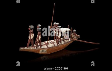 Ancient Egyptian wooden model boat from tomb of Shemes,  Middle Kingdom (1980-1700 BC), Asyut. Egyptian Museum, Turin. black background  In 1908 in As Stock Photo