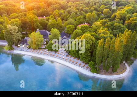 Beer garden and restaurant Seehaus am Kleinhesseloher See in the morning light, English Garden, Munich, aerial view, Upper Bavaria, Bavaria, Germany Stock Photo