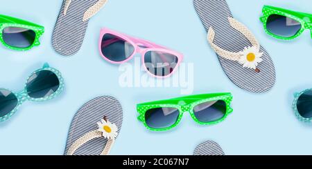 Sunglasses and flip flops summer seamless texture. Fabric daisy pattern backdrop over blue background Stock Photo