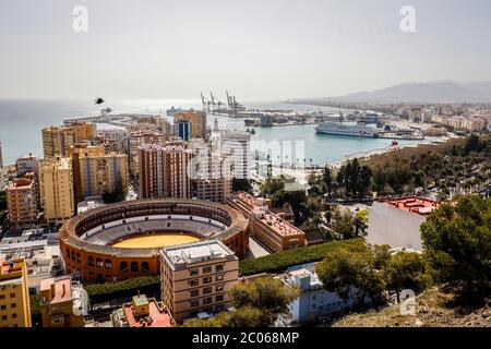 Bullfighting arena and the new harbour district with promenade Muelle Uno, Malaga, Andalusia, Spain Stock Photo