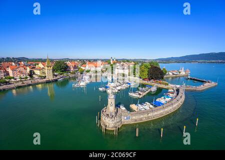 Sea promenade, harbour square, old lighthouse, Mangturm or Mangenturm, and the Bavarian lion in the harbour on the island, Lindau island, Lindau on Stock Photo