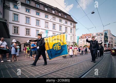 People from Oberschlesien showcasing the traditional local outfit at the summer fair parade. Kiliani is a 2-weeks-long folk festival with brass music. Stock Photo