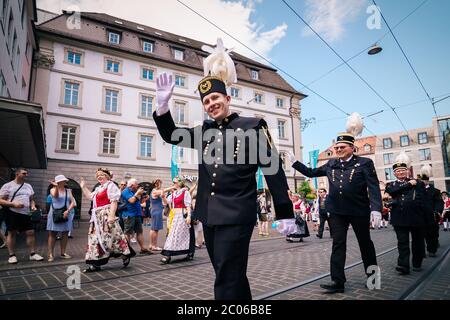 People from Oberschlesien showcasing the traditional local outfit at the summer fair parade. Kiliani is a huge folk festival with brass music. Stock Photo