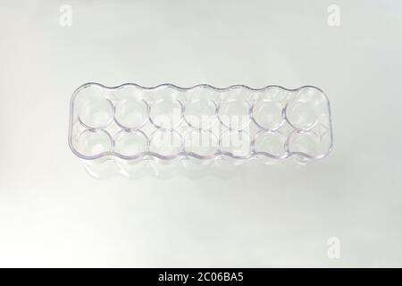 Plastic eggs box isolated on white background. Stock Photo