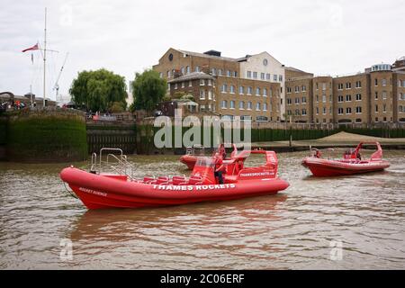 LONDON, UNITED KINGDOM - JUNE 24, 2019: Thames Rockets, red speedboat on river Thames in London, UK. Stock Photo
