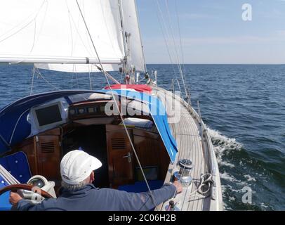 skipper on sailing vessel Stock Photo