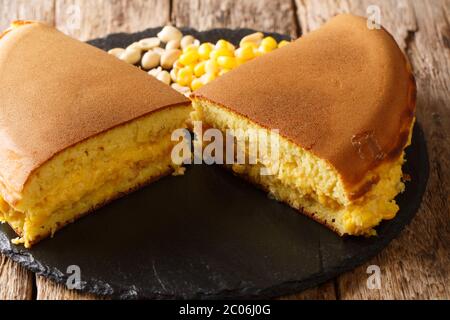 Apam Balik is a sweet Malaysian peanut pancake turnover stuffed with a sugary, buttery peanut filling close-up on the table. Horizontal Stock Photo