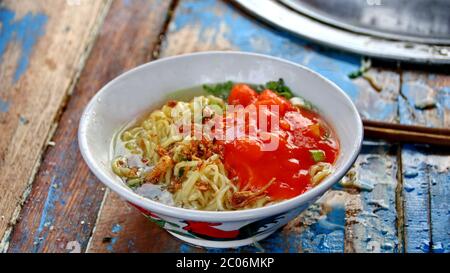 street chicken noodle sellers prepare food menus  on the cart. Not focus, noise and Blurry selective focus image Stock Photo