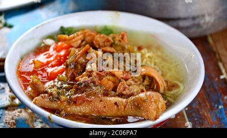 street chicken noodle sellers prepare food menus  on the cart. Not focus, noise and Blurry selective focus image Stock Photo