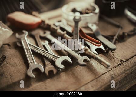 Old work tools in garage closeup. Stock Photo