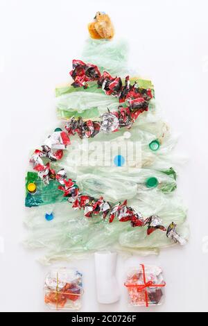 christmas tree and gifts from plastic waste on white background, conceptual, flat lay Stock Photo