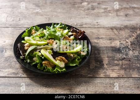 Fresh Waldorf salad with lettuce, green apples, walnuts and celery isolated on whtie background Stock Photo