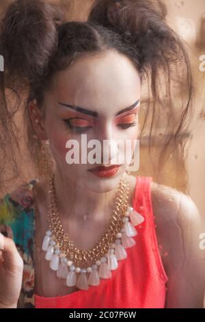 Close up stylized portrait of a Japanese geisha with bright make up Stock Photo