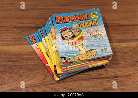 Beano Comic Library No.67 1985 'Gnasher in Stowaway' stacked in a pile of Beano comics Stock Photo