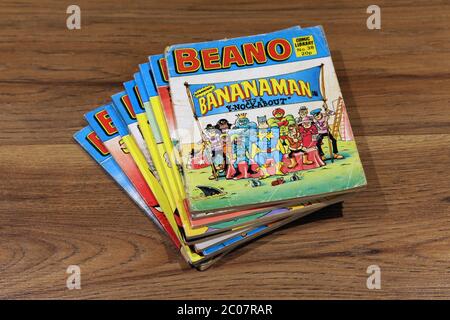 Beano Comic Library No.38 1983 'Bananaman in It's a Knockabout' stacked in a pile of Beano comics Stock Photo