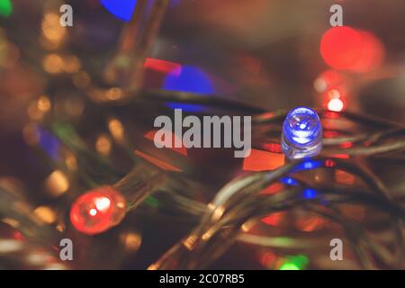 LED lights garland, colorful light bulbs on a bokeh background Stock Photo