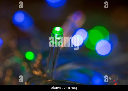 LED lights garland, colorful light bulbs on a bokeh background Stock Photo