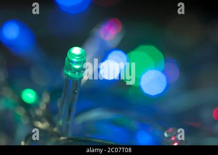 LED lights garland, colorful light bulbs on a bokeh background Stock Photo