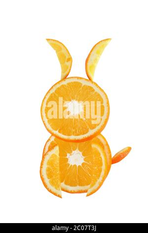 Healthy eating. Funny little rabbit made of the orange slices. Stock Photo